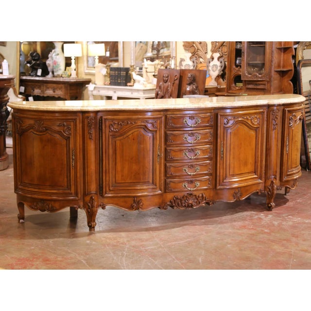 This substantial antique French enfilade, crafted in Provence circa 1920, showcases the elegance and movement of the Louis...