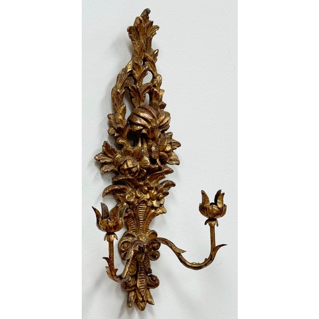 Vintage gilt wood wall sconce manufactured by Palladio and Made in Italy. Depicts an ornate floral bouquet in a vase...
