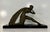 An elegant Art Deco bronze sculpture depicting the iconic model "Femme à la Draperie", signed by the renowned sculptor...