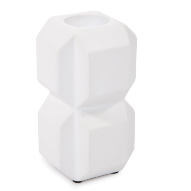 The simplicity of the cube is studied and refined in the cubic candle holders. Angled edges gave each section of stacked...