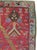 This early 20th century Turkish Ghourdes rug, measuring 3' 0" x 4' 8", presents a bold directional prayer design centered...