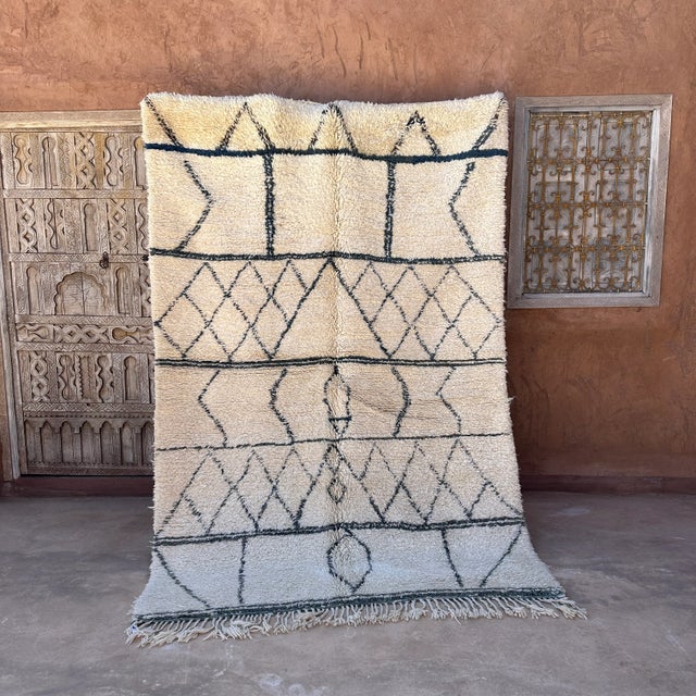 Beni Ourain rug is an exquisite piece of textile art that has been produced for centuries by the indigenous Berber tribes...