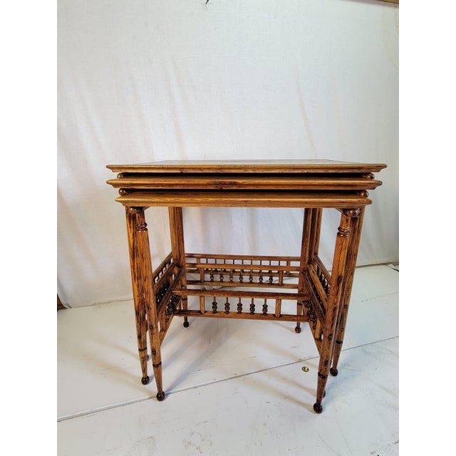 This exquisite 19th Century Victorian Chestnut Stacking Ball Nesting Table Set is a stunning example of craftsmanship ....