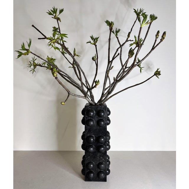 Handcrafted from black marble, the Bubble Vase pairs a clean architectural silhouette with playful spherical detailing for...