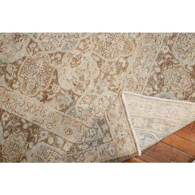 1940s Persian rug in warm brown, ivory and light blue tones Measures: 8'5'' x 11'6''.