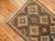 A tribal balouch rug from the early 20th century in brown and orange accents, circa 1930 Measures: 2'6” x 3'10”.
