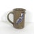Vintage studio pottery stoneware mug with a bird. This is brown with a raised great blue heron on the side. Very well done...