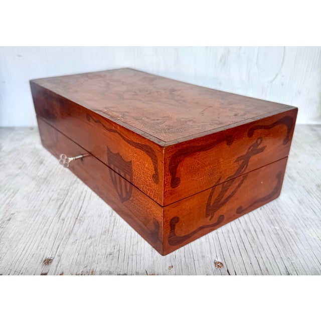 Rare and beautifully handcrafted, this antique Coast Guard travel backgammon set is a striking example of functional folk...