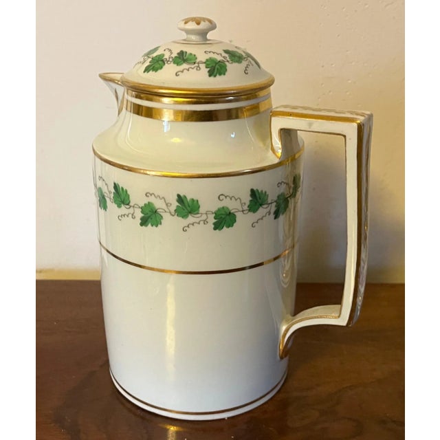 Antique early 19th century Vienna porcelain coffee pot decorated with a green ivy garland and gilt monogram. Measures 7...