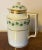 Antique early 19th century Vienna porcelain coffee pot decorated with a green ivy garland and gilt monogram. Measures 7...