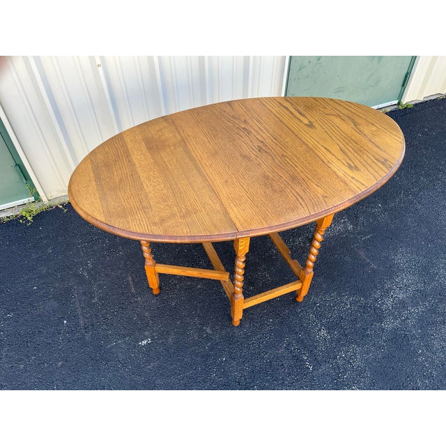 Early 1900's English Oak Barley Twist Oval Gate Leg Table For Sale - Image 10 of 12