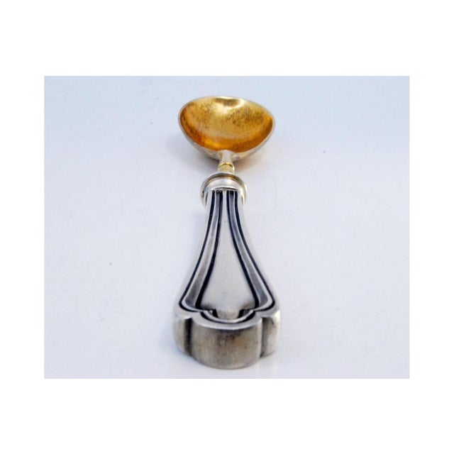 Silver Sauce Spoon with Golden Shell and Raised Stripes, in Very Good conditions. Designed 1920 to 1949 This piece has an...