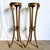 A striking pair of vintage Neoclassical giltwood pedestals featuring exquisitely carved ram heads and elongated tripod...