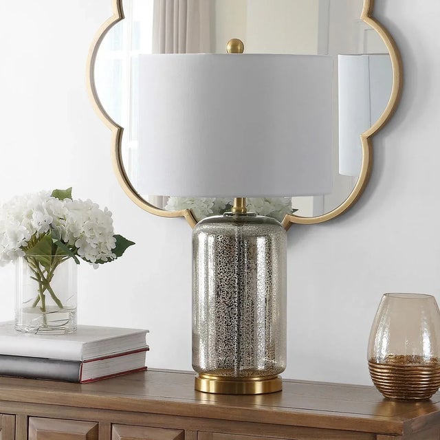 Illuminate your space with the stylish NOVAH 26 inch glass table lamp. With its sleek silver finish, this lamp...
