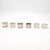 An assembled set of six silver napkin rings, France, 19th century. The larger rings measure 1.675" h x 2.125" d, and the...