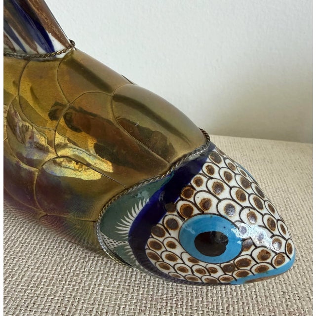 Vintage brass and ceramic Koi fish table sculpture in the manner of Sergio Bustamante circa 1970s layered solid brass and...
