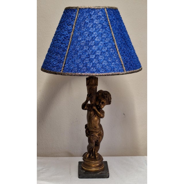 Vintage Table Lamp with Gold-Patinated Putto Base and Fabric Shade from Lamplove, 1970s, in Very Good conditions. Designed...