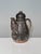 This handcrafted coffee pot by the German ceramicist Helma Klett (1908-1996) showcases the characteristic rustic aesthetic...