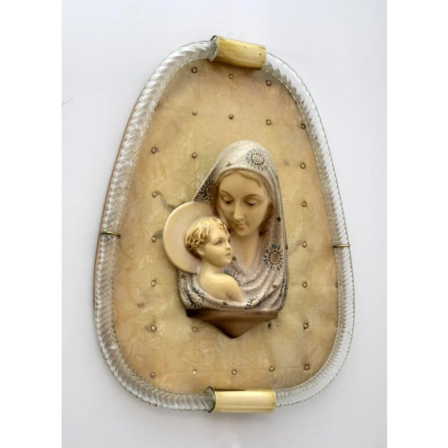 Torchon frame in Murano glass Manifatta Venini, inside Madonna with chalk child on a xylonite base, dating back to the...