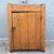A charming antique primitive storage cupboard crafted from solid wood with a beautifully aged warm honey-brown finish. The...