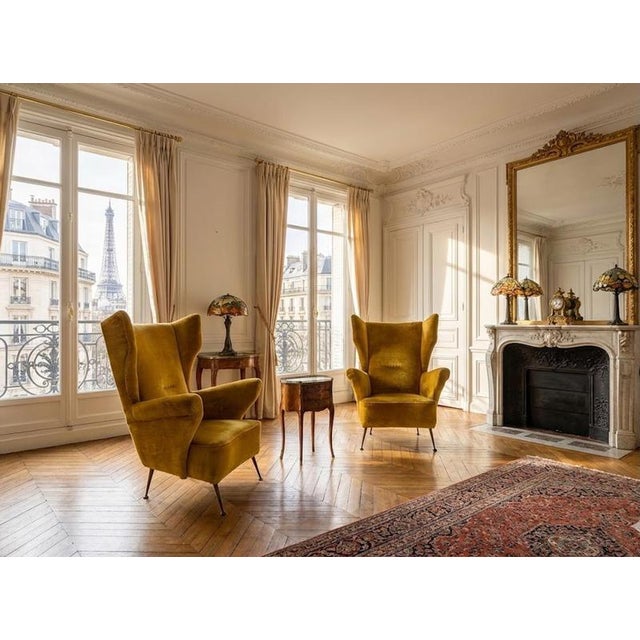 These two armchairs perfectly embody the spirit of 1950s Italian midcentury, with that blend of sculptural elegance and...