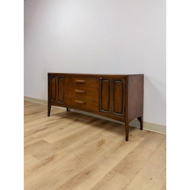 This exceptional vintage Broyhill Emphasis credenza is one of the most coveted and collectible pieces in the entire mid-...