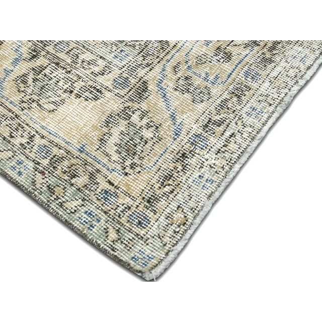 This Vintage Turkish Oushak Rug adds a vibrant touch to any home with its combination of wool and cotton. Measuring 6'10"...