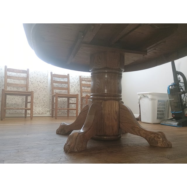Wood Antique Round Oak Pedestal Dining Table With Claw Feet Dating From the Late 19th to Early 20th Century. For Sale - Image 7 of 14