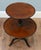 A victorian mahogany two-tier dumb waiter dating to circa 1880. The two circular tiers have raised rims and provide...