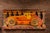 c. 1930s Late Art Deco-early Streamline English carnival ride panel. This vibrant carved wood panel once adorned a car-...