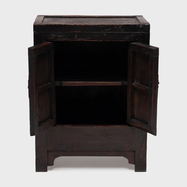 This small Chinese locking cabinet from the early 20th century has a richly aged patina that only time can achieve. The...