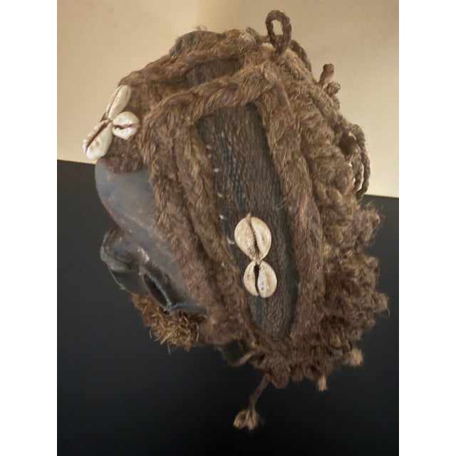 Antique Dan Mask from the Ivory Coast. 20th century. Shows signs of aging on the patina. Made of wood , fiber , textiles...