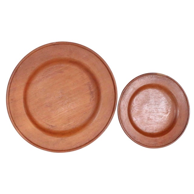 Lot of two mid century wood ware plates, in good, original estate condition. The larger plate is 12" in Dia. x 1.25" H,...