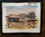 A serene, original watercolor depicting a classic Western log cabin or homestead. The composition focuses on organic...