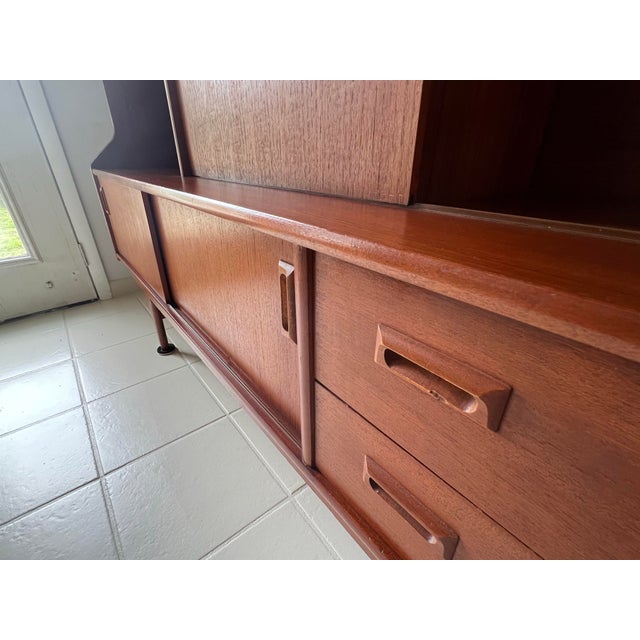 Mid Century teak hutch in excellent condition. Resides in a clean home. It has the expected light wear of a vintage item...