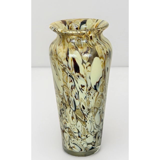 Elegant vintage Murano-style art glass vase featuring a beautiful blend of cream and brown tones in a hand-blown glass...