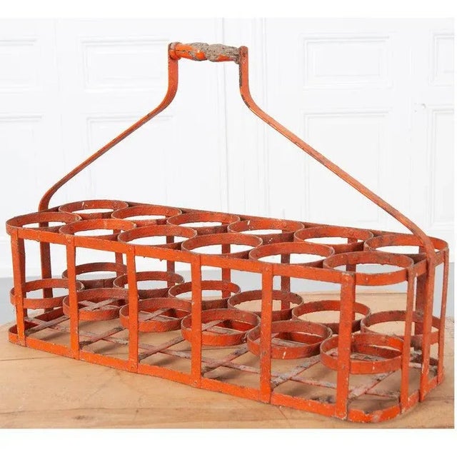 Early 20th century, circa 1900, 12 bottle carrier basket from France. Handmade bottle rack, made of metal with a wooden...