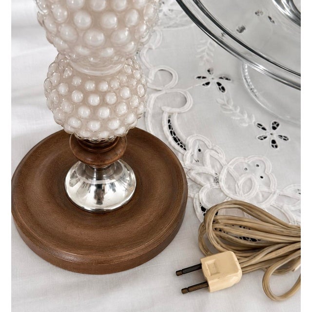 A charming pair of vintage mid-century table lamps featuring stacked hobnail bodies with original Leviton sockets. Tested...