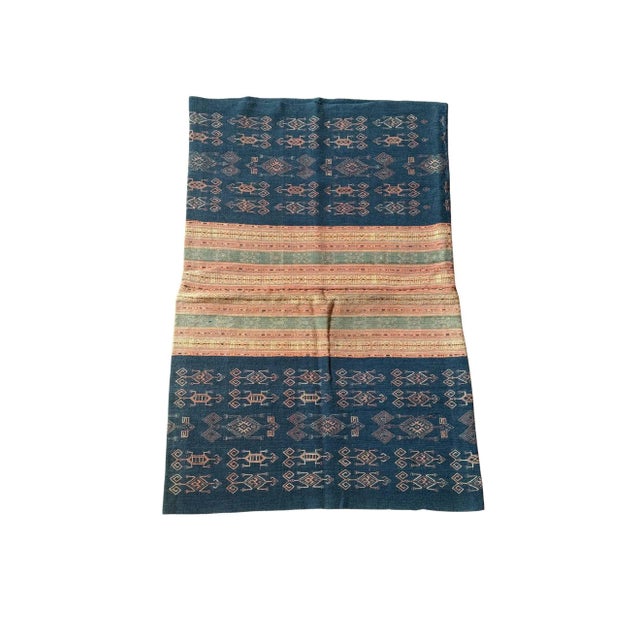 This mid-20th century ikat textile from Timor Island, Indonesia is a striking example of traditional Indonesian weaving,...