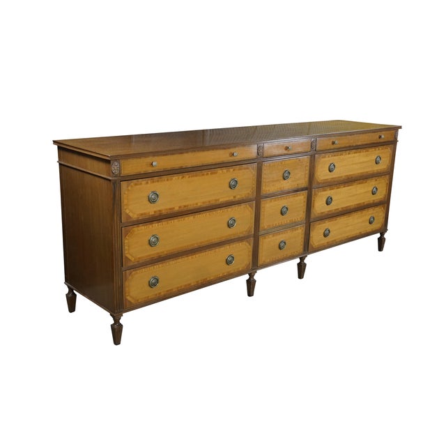 This exceptional Kittinger triple dresser showcases the brand's signature high-end craftsmanship, executed in a stately...