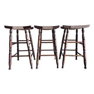 Set of 3 Mid Century Bar Stools Primitive Craft Movement Turned Walnut Bobbin Spindle Legs and Danish Cording Woven Seats For Sale