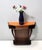 Made in Italy, 1950s. This console table is made in beech and walnut root and features an orange back-painted glass top,...