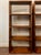 This exceptional pair of modern bookcases by McGuire is hand crafted by trained artisans and features gently curved frames...