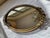 Here we have a lovely vintage oval mirrored vanity tray with exquisite gold metal filigree banding and applied cast floral...