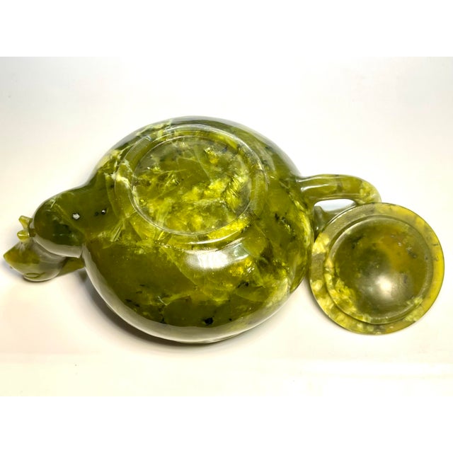 Exceptional carved antique Chinese Quing style Bowenite Jade Dragon tea pot. The item measures 5.25” x 3.5” x 2.3”. The...