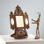 Adjustable, openable freestanding mirror in perforated and inlaid wood. The sides feature scenes of everyday life in...