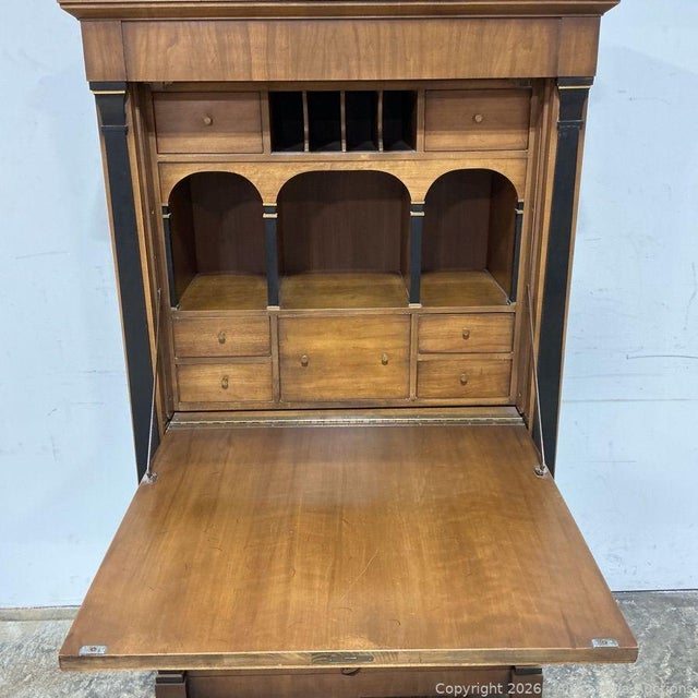 The Drexel Flip Down Walnut Secretary Desk is a vintage piece of furniture perfect for any home or office space. This desk...