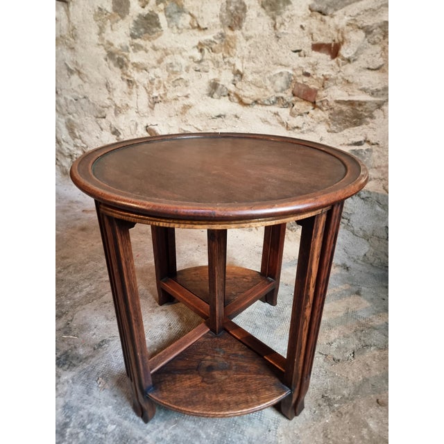 This nesting table set was produced in France during the 1960s and is crafted from oak with a rich dark finish. The design...