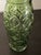 Vintage 1960s green pressed-glass vase with a scalloped rim and molded floral/geometric decoration. Approximately 2” x 2”...