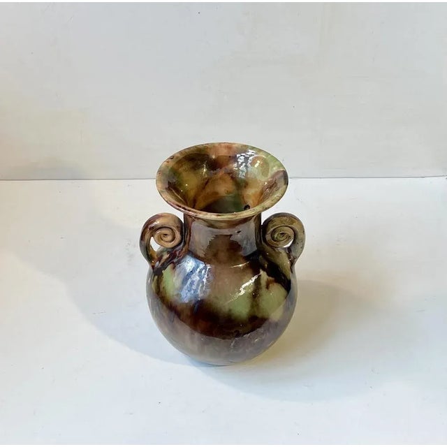 Art Deco ceramic vase with Majolica camouflage glaze and swirling handles. Designed and made around 1920 by Michael...